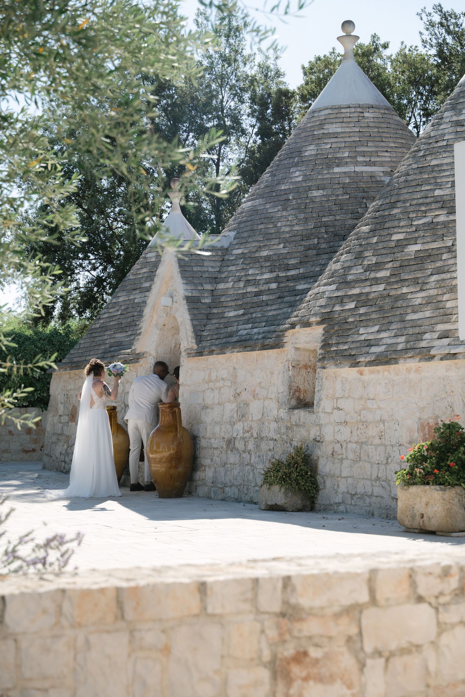 Destination wedding photography in Alberobello, Puglia, captured in digital with a clean and elegant visual style.