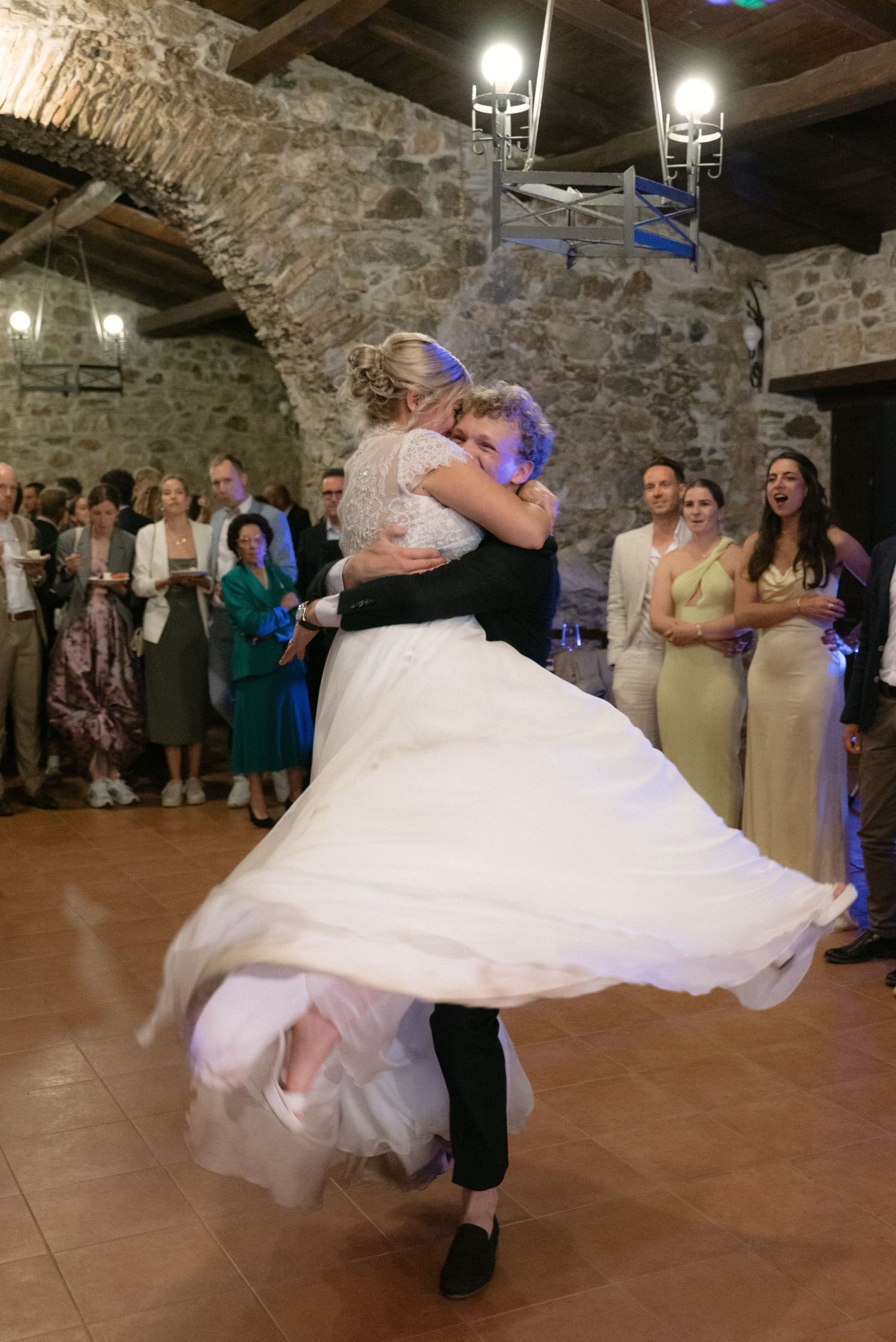 Bride and groom dancing together at the end of their Calabria wedding