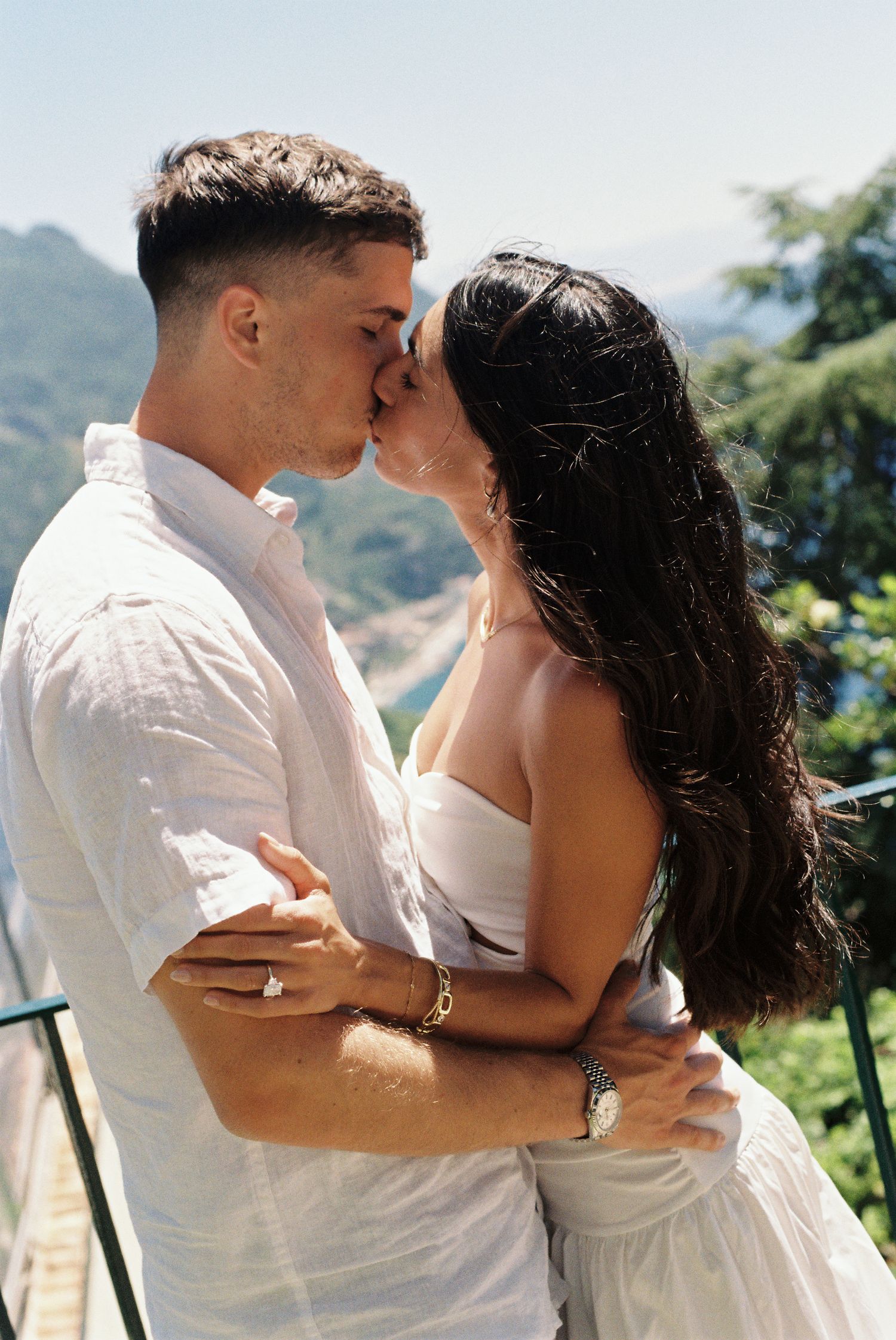 Couple kissing after a surprise proposal on the Amalfi Coast