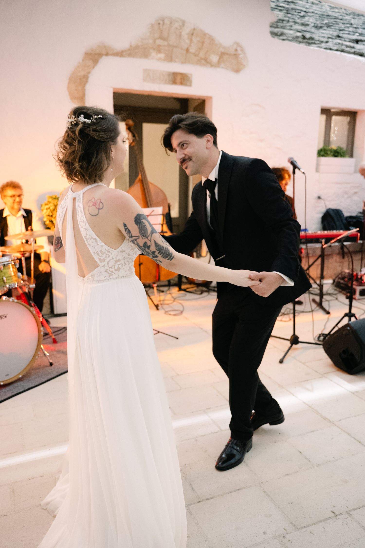 Destination wedding photography in Alberobello, Puglia, captured in digital with a clean and elegant visual style.