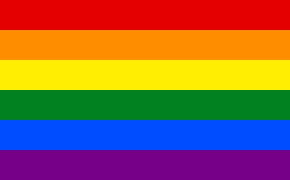 Rainbow pride flag with six horizontal stripes in red, orange, yellow, green, blue, and purple colors.