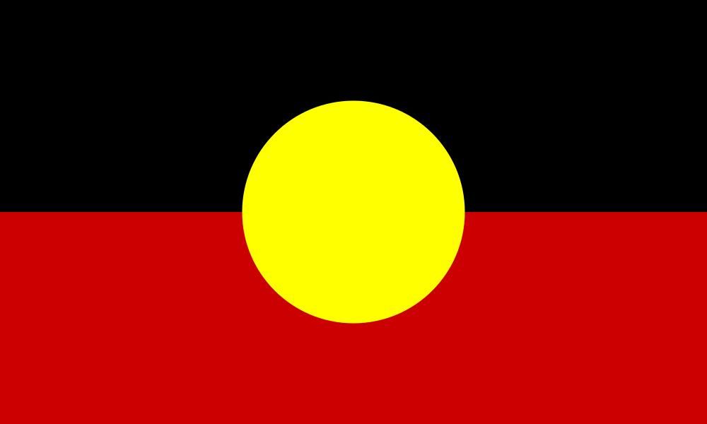 Australian Aboriginal Flag featuring black and red horizontal halves with a yellow circle centered on the flag.