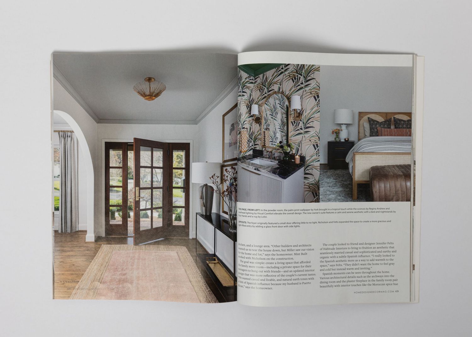 Modern entryway with French doors and tiled flooring alongside decorative wall art and fixtures.