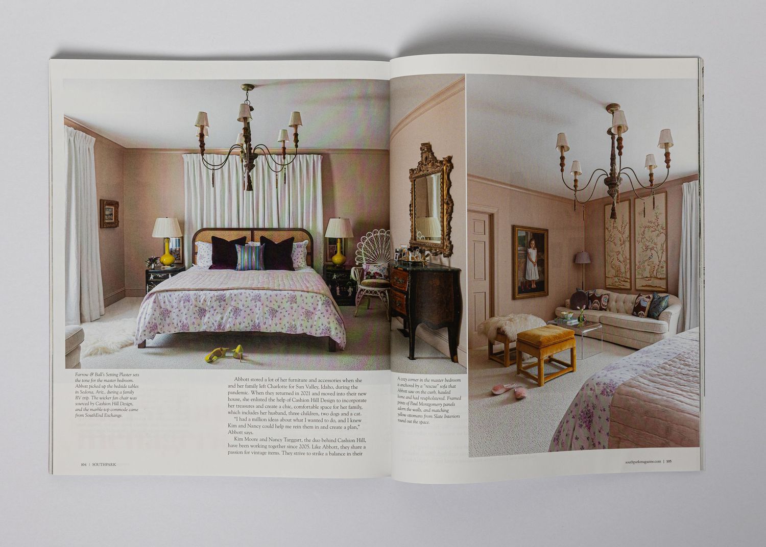 Elegant master bedroom with chandelier and adjoining sitting area featuring classic traditional decor.