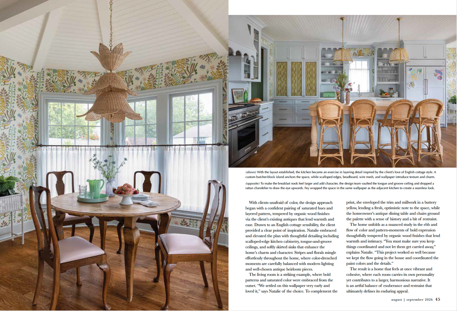 Bright dining room with floral wallpaper and wooden furniture beside a modern kitchen with blue cabinets and rattan bar stools.