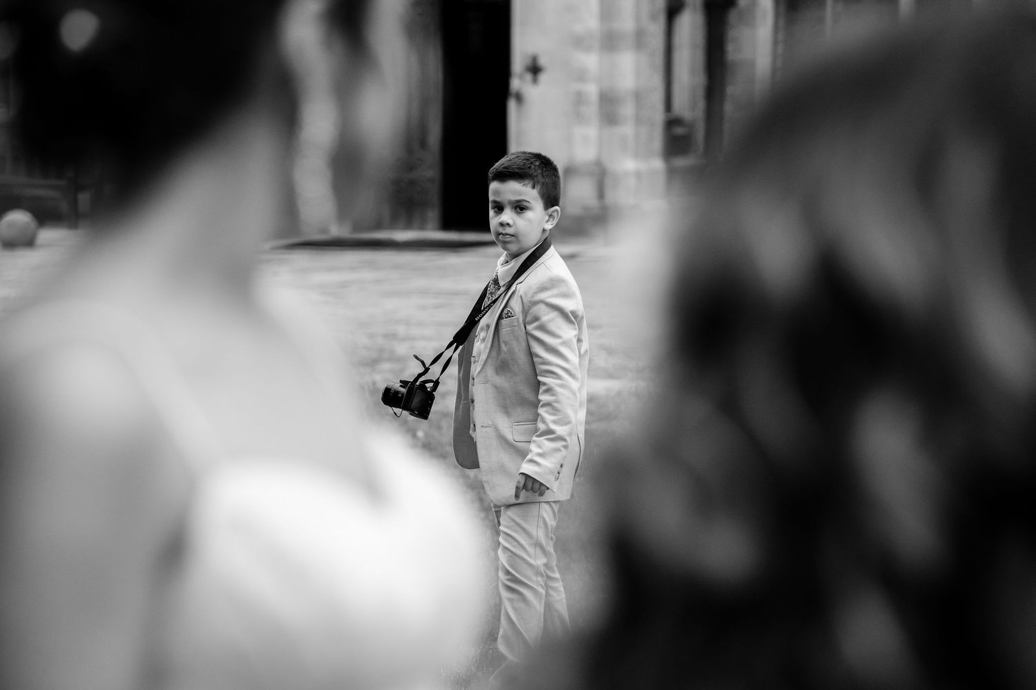 Black and white artistic wedding photography with selective focus and bokeh effects.