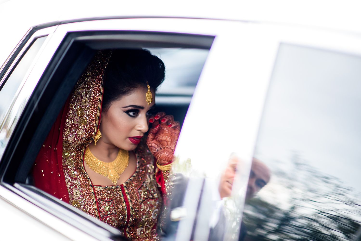 Artistic wedding photography sequence showing bride in car wearing traditional Indian bridal attire.