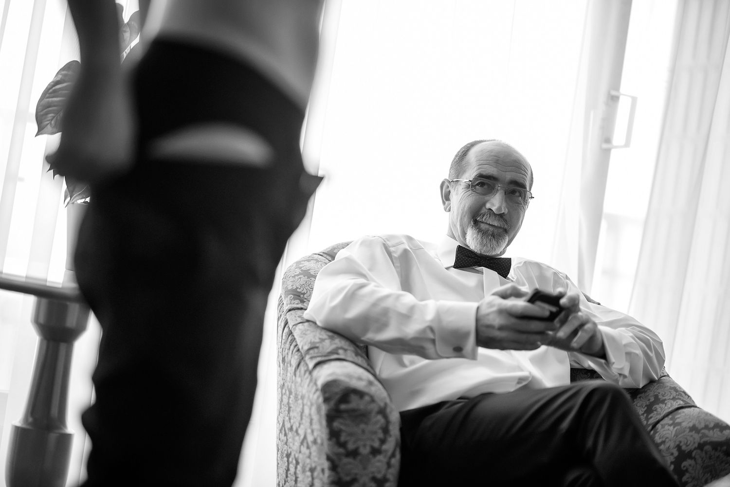 Black and white candid reception moments captured in an artistic style.