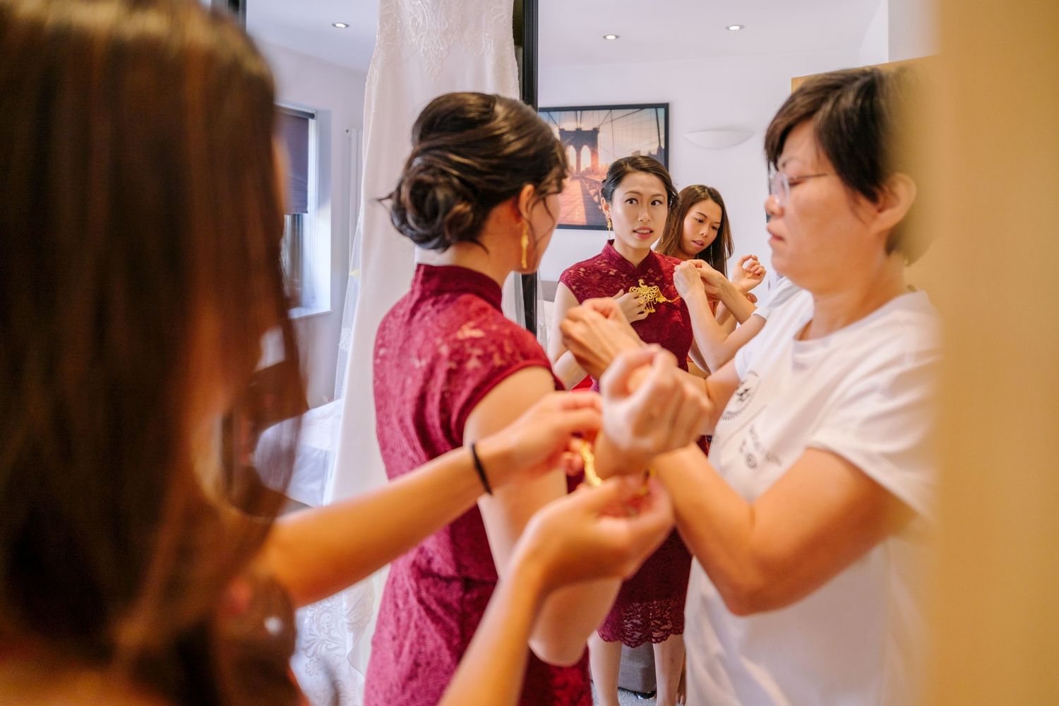 People dancing together in a warm-lit indoor space during a dance class or social gathering.