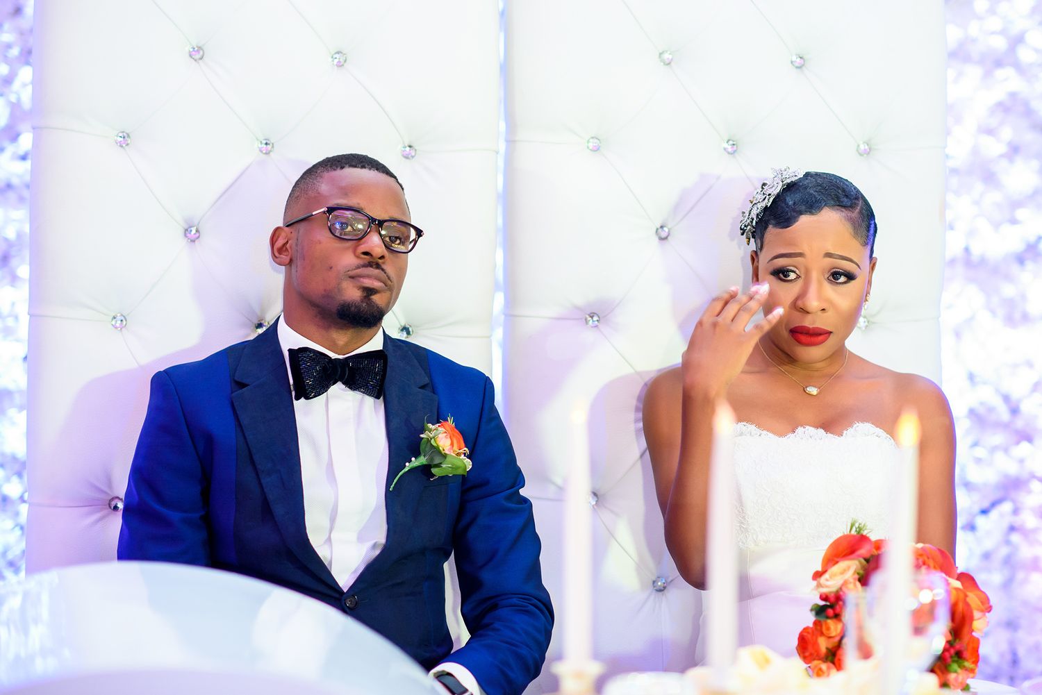 Elegant wedding portraits showing bride and groom in formal attire with glowing lighting and florals.