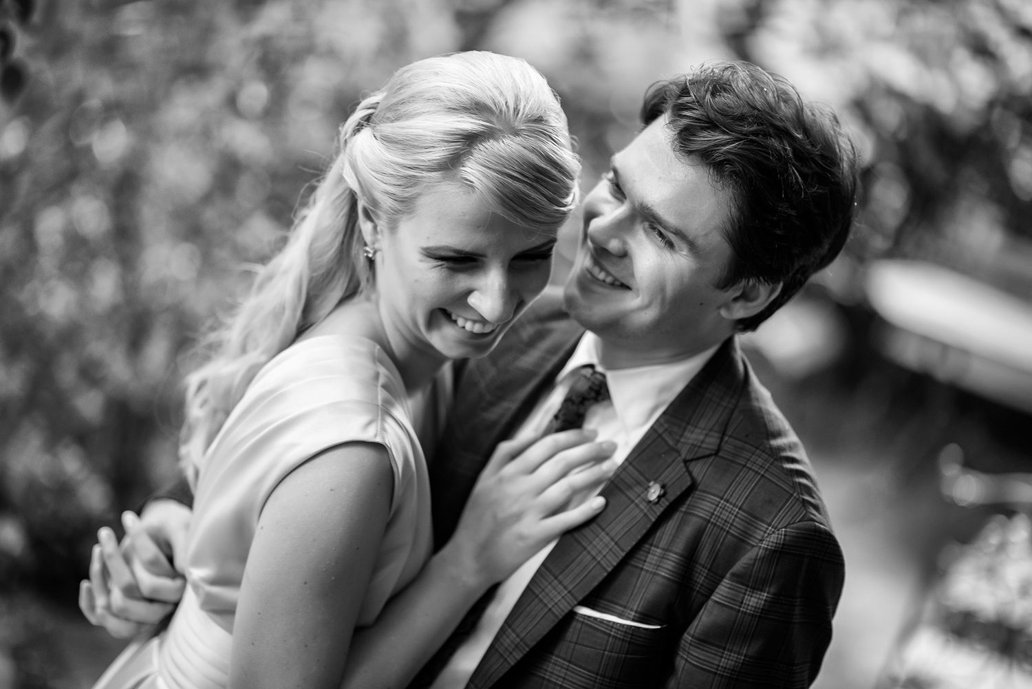 A romantic black and white wedding photography montage showing intimate moments between newlyweds.