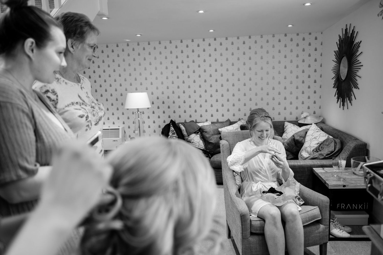 Black and white photographs documenting healthcare workers providing patient care in a medical setting.