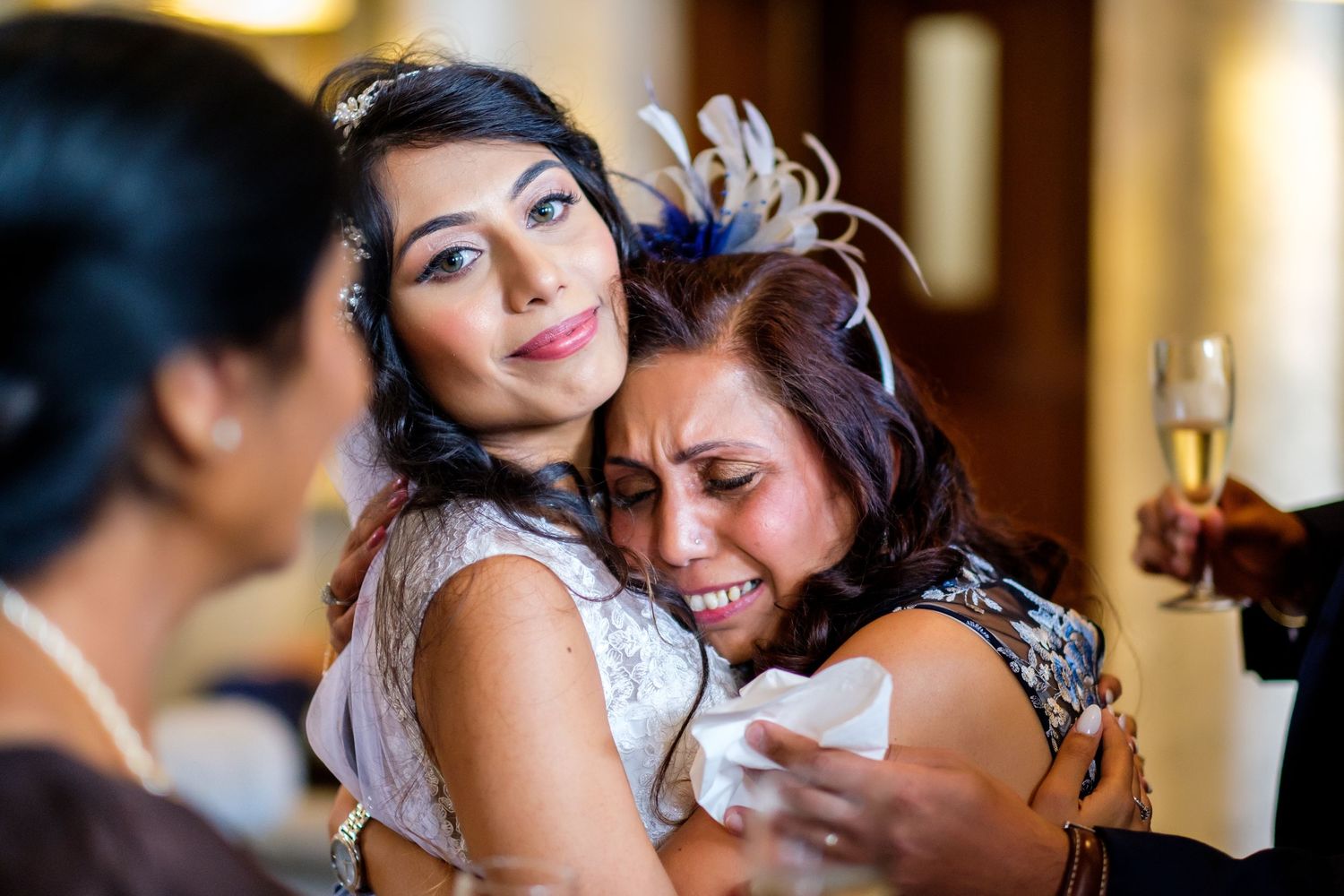 Intimate close-up shots of wedding reception moments in warm lighting.