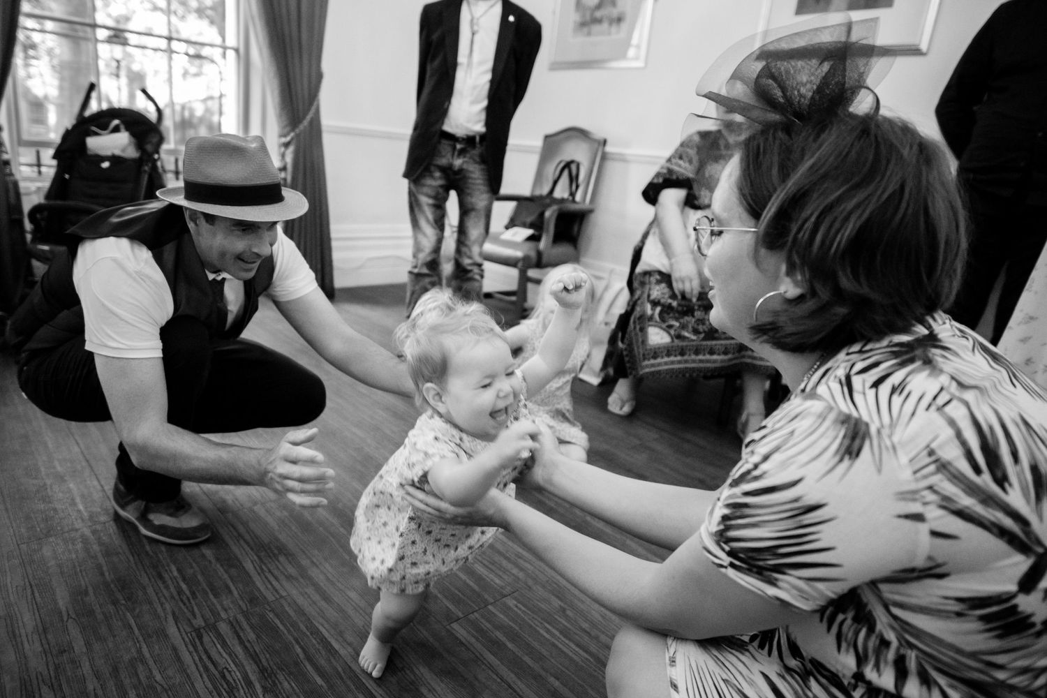A collection of black and white photographs showing people dancing and interacting in what appears to be a dance studio.