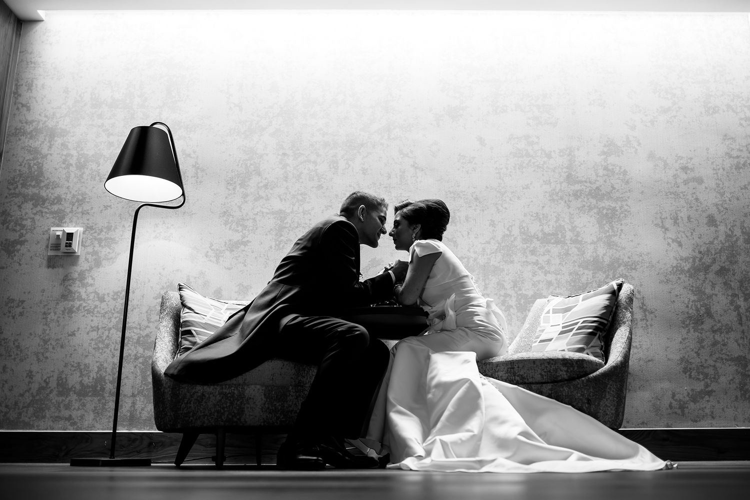 Artistic black and white silhouettes capturing intimate wedding photography moments.