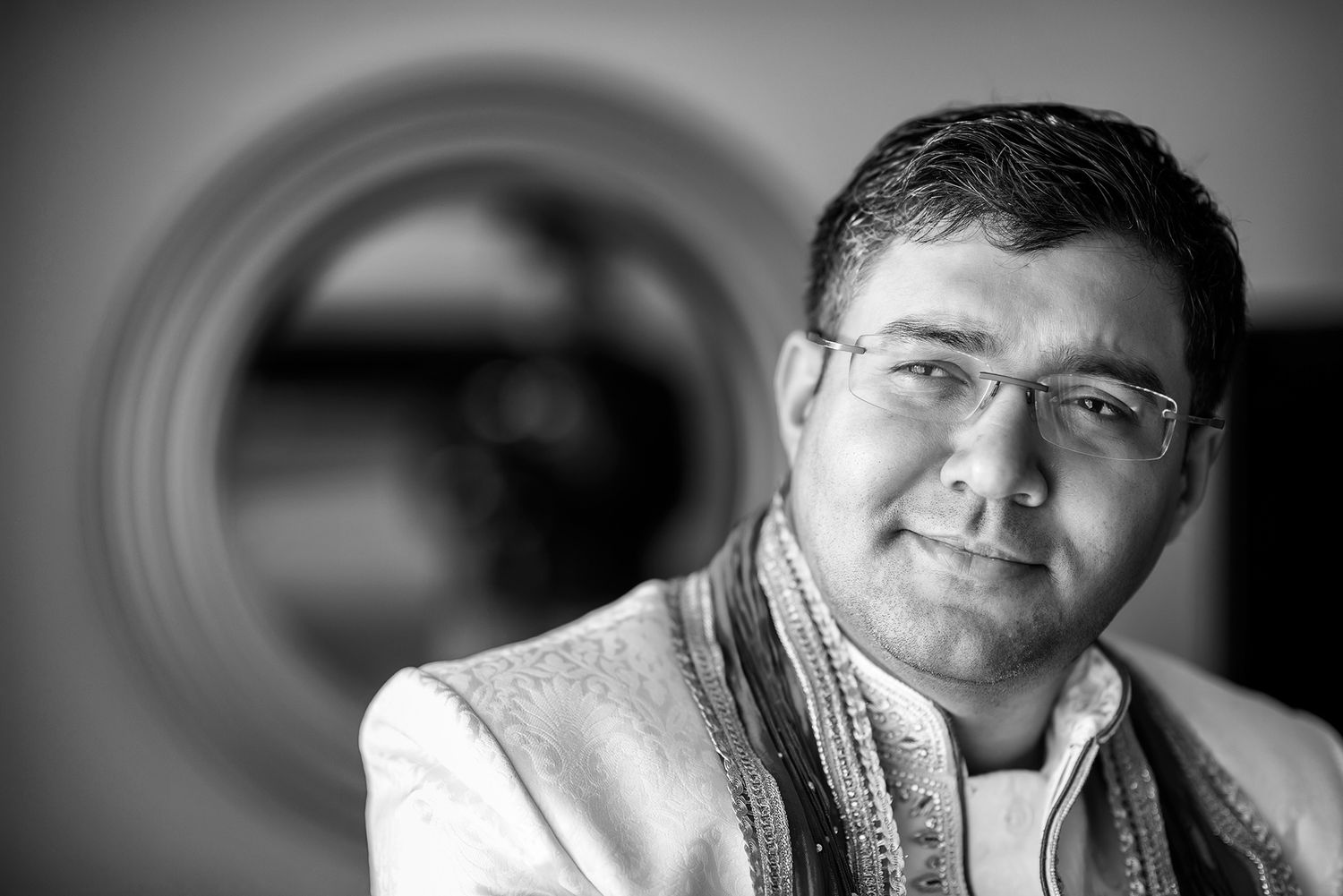 Sequence of black and white headshots with moody lighting and vignettes.