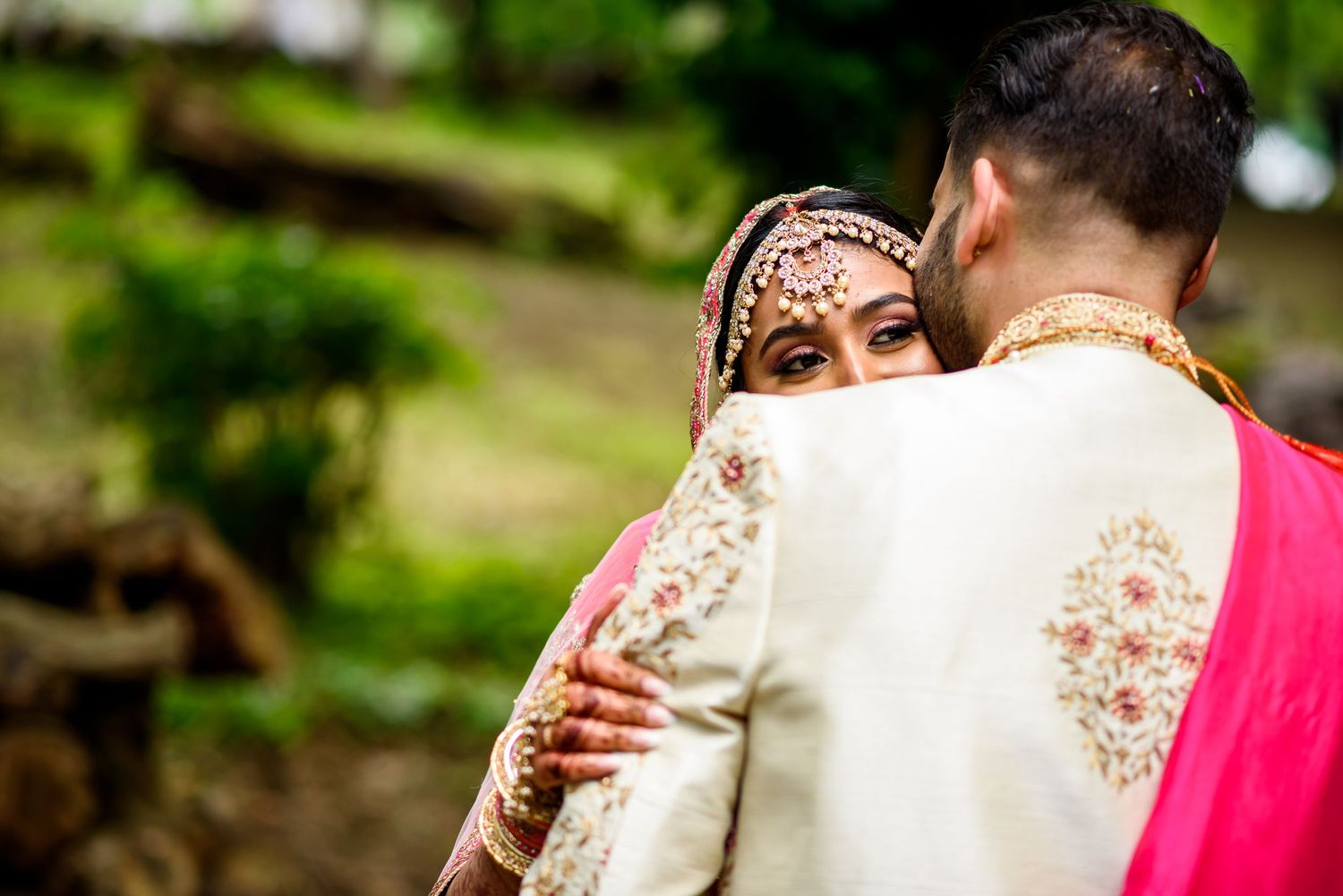 Intimate wedding ceremony moment captured in a natural outdoor setting.