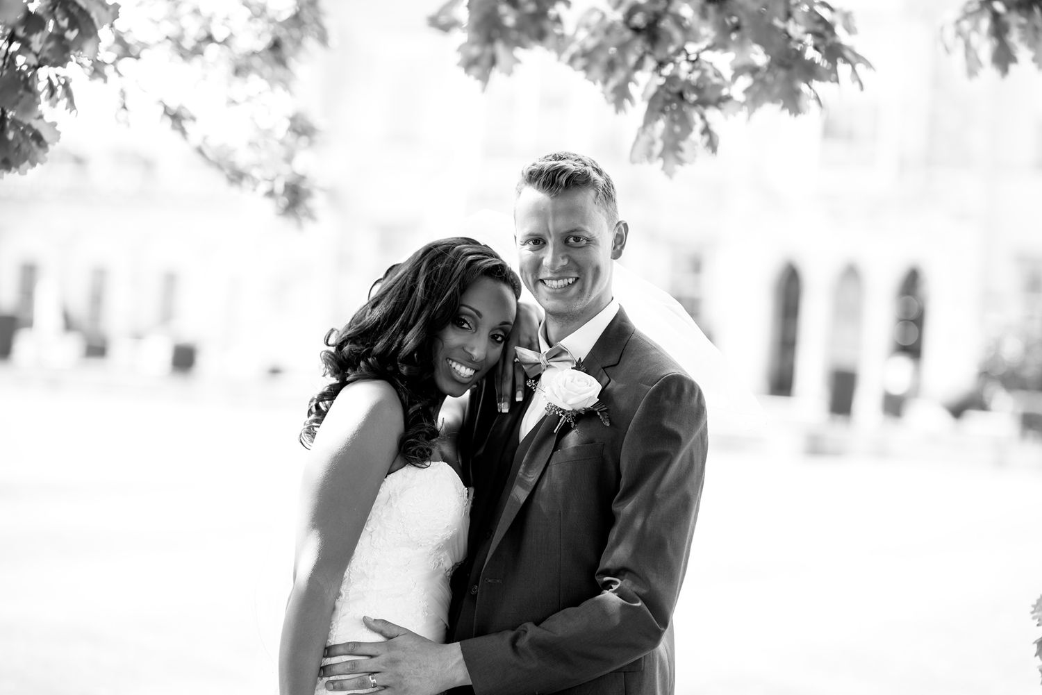 Romantic black and white wedding portraits in garden setting.