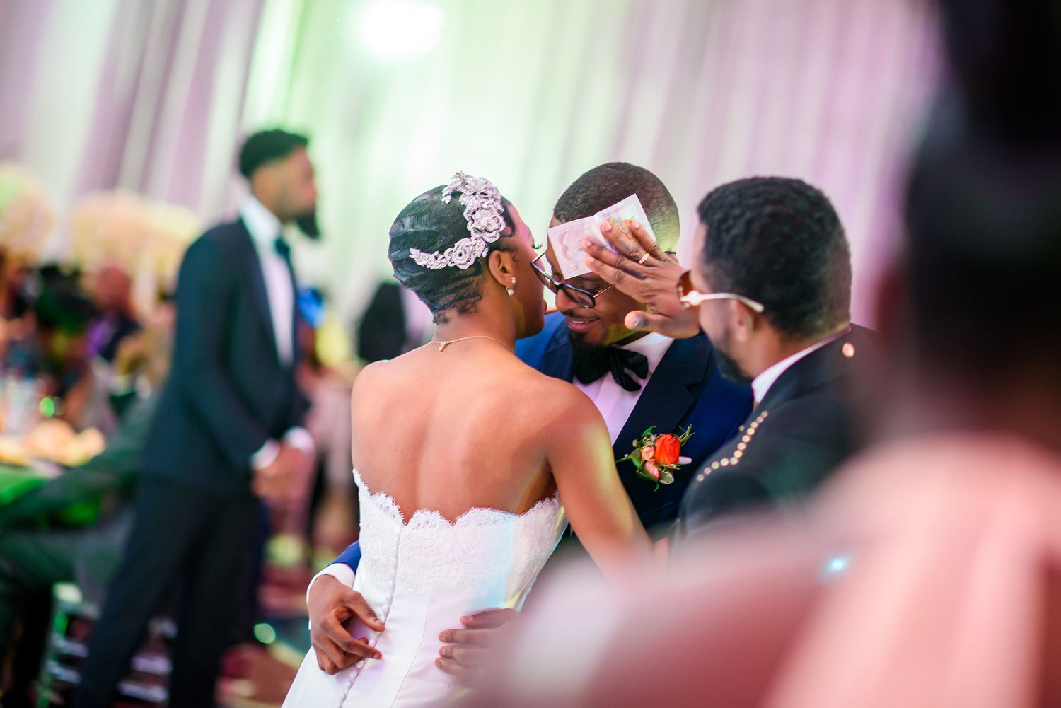 Dancing couples share intimate moments during a romantic wedding reception.