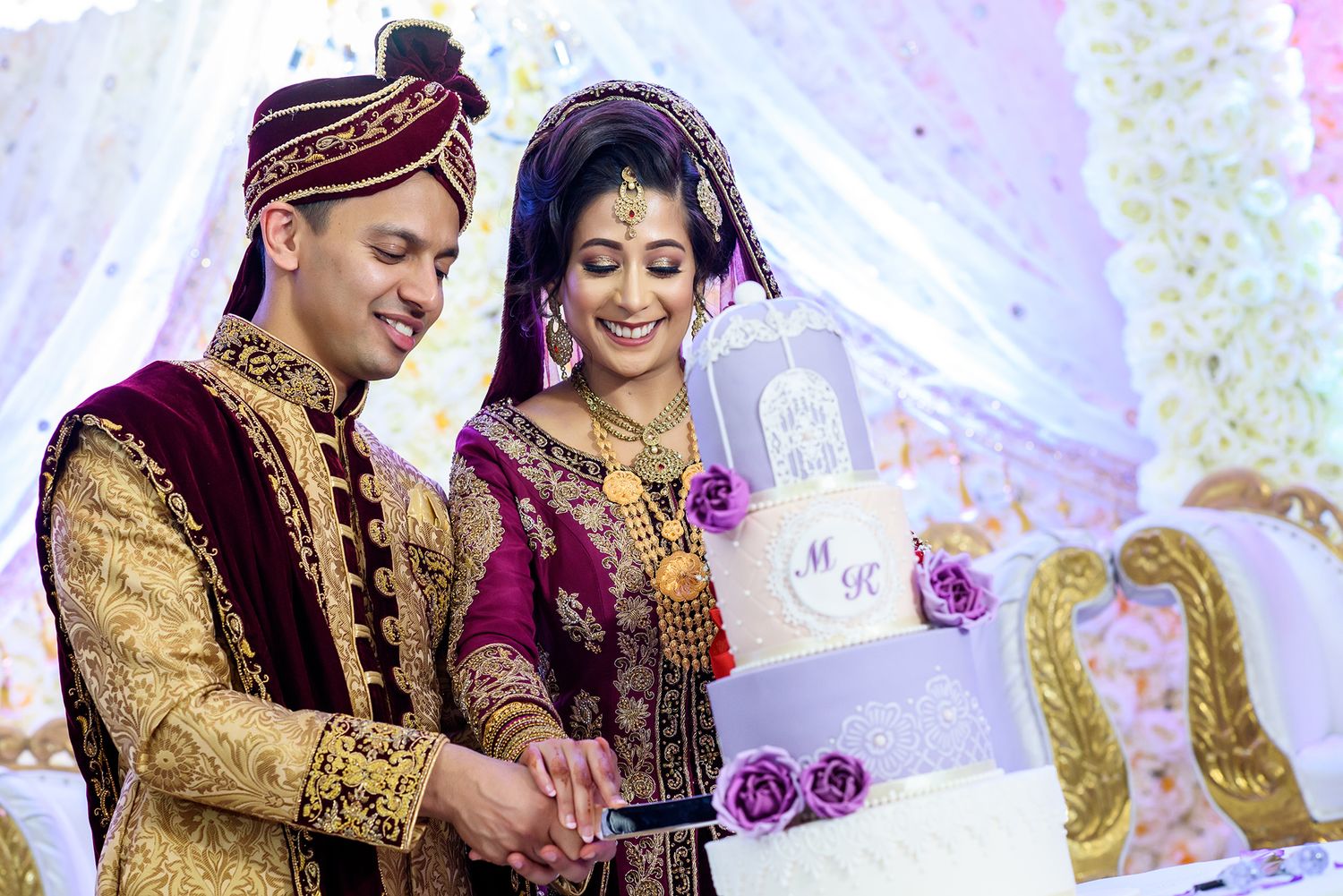 Traditional South Asian wedding ceremony with elaborate decor and formal attire.