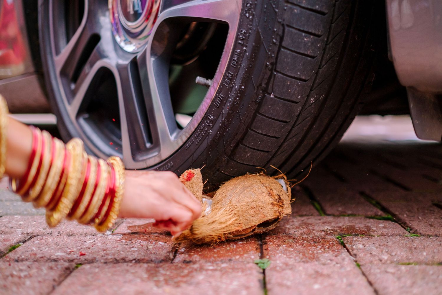 Close-up of car tire and wheel maintenance being performed on a vehicle.