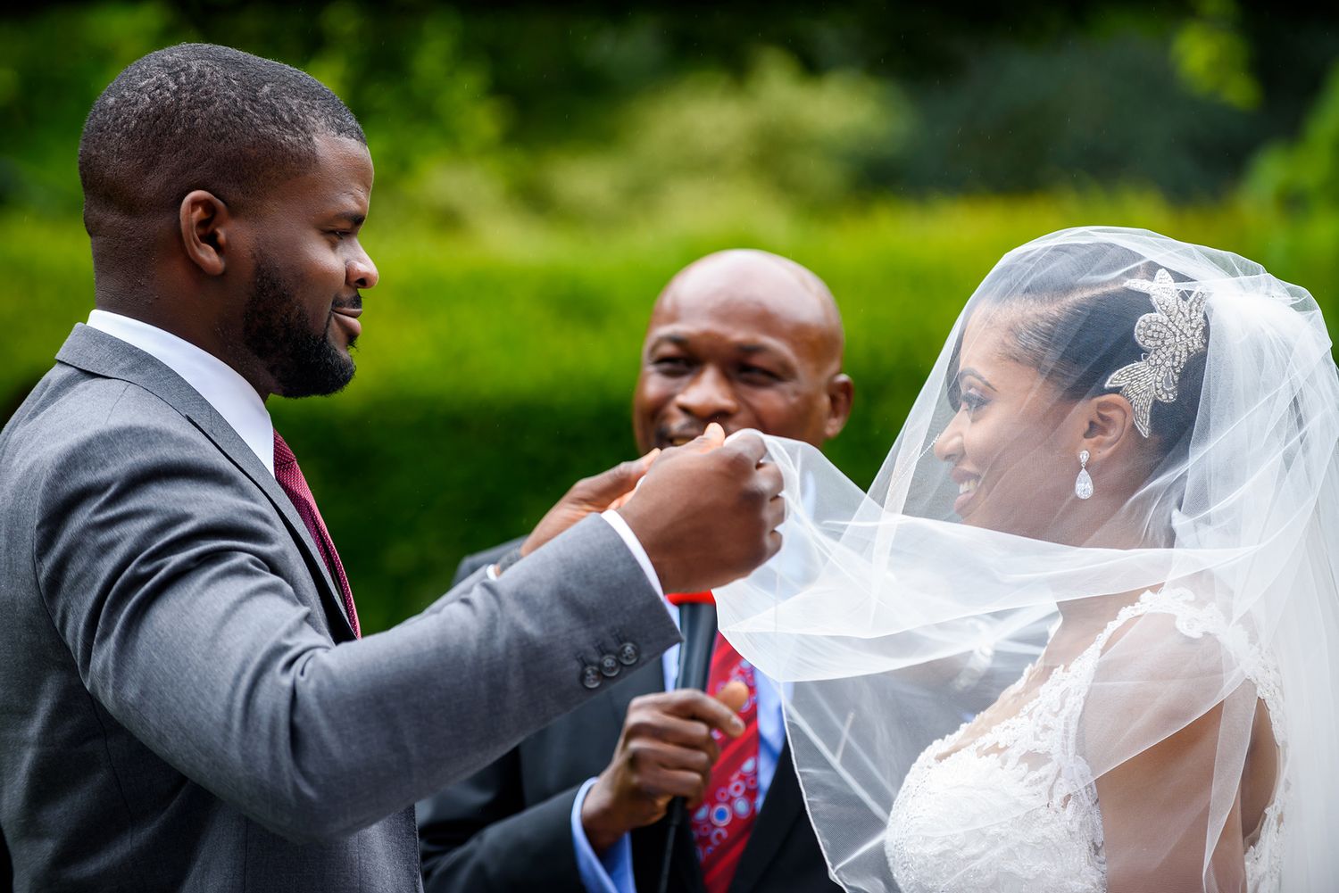 Candid outdoor wedding ceremony moments captured in natural lighting.