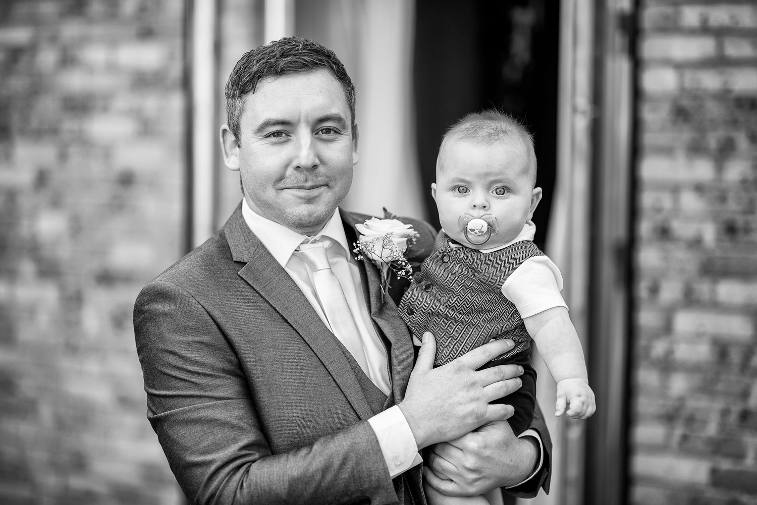 Black and white portraits captured during wedding day preparations.