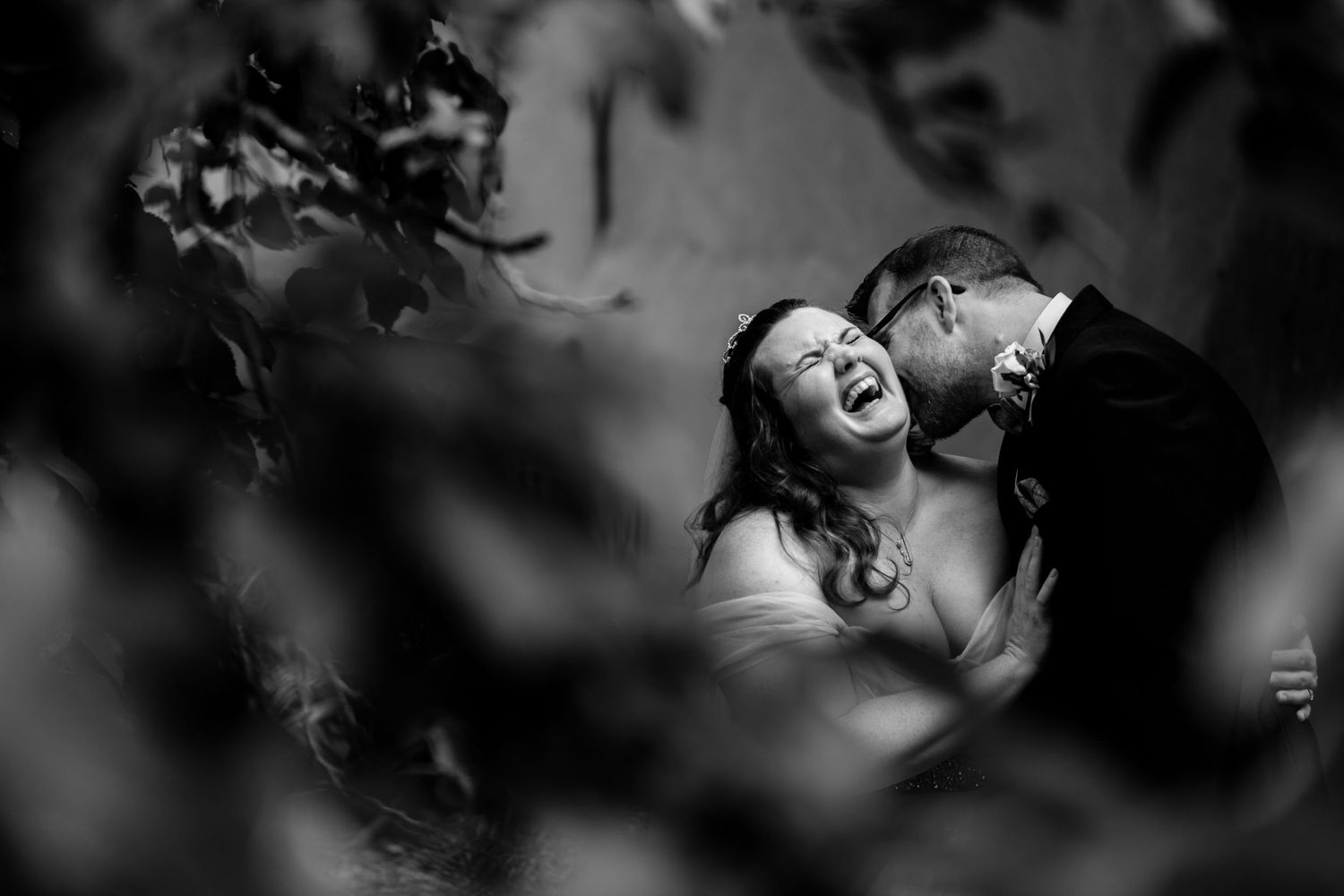 Black and white candid shots capturing joyful wedding moments.