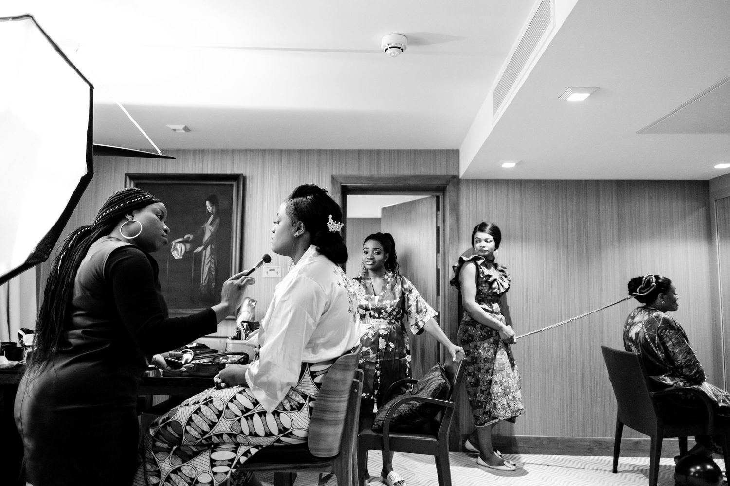 People seated at tables in a modern conference room during a business meeting or workshop session.