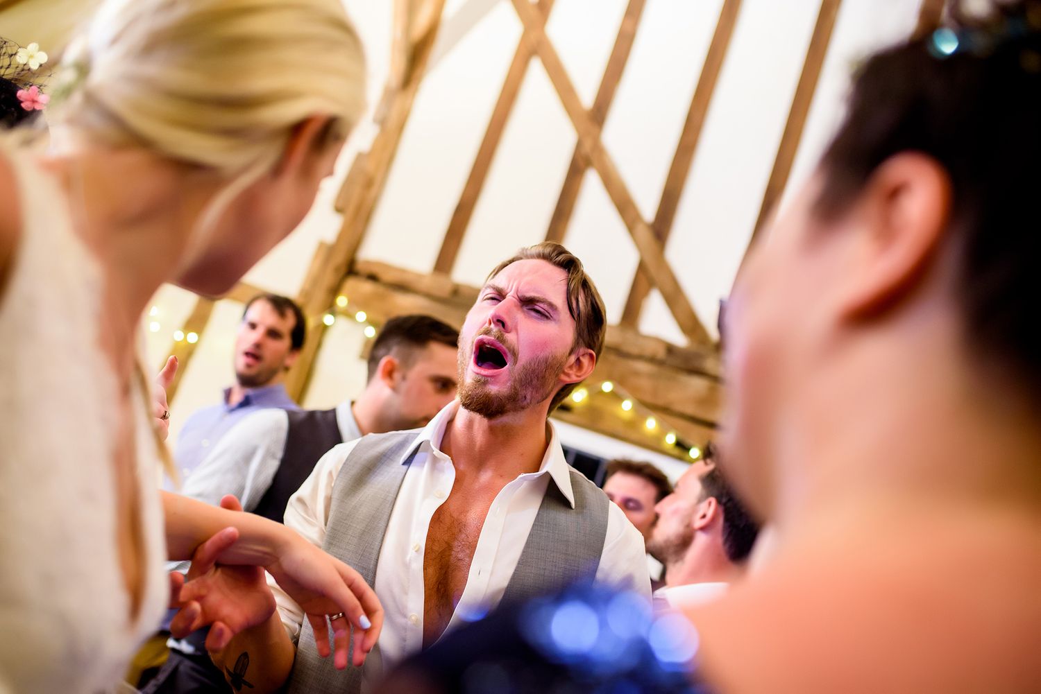 Joyful celebration moment captured during a lively wedding reception.