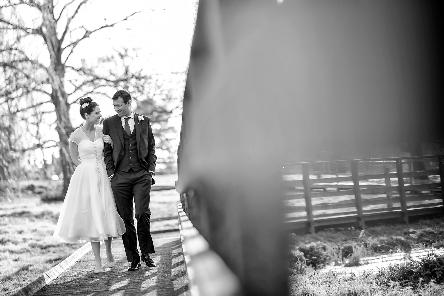 Black and white wedding photography sequence showing romantic moments between newlyweds.