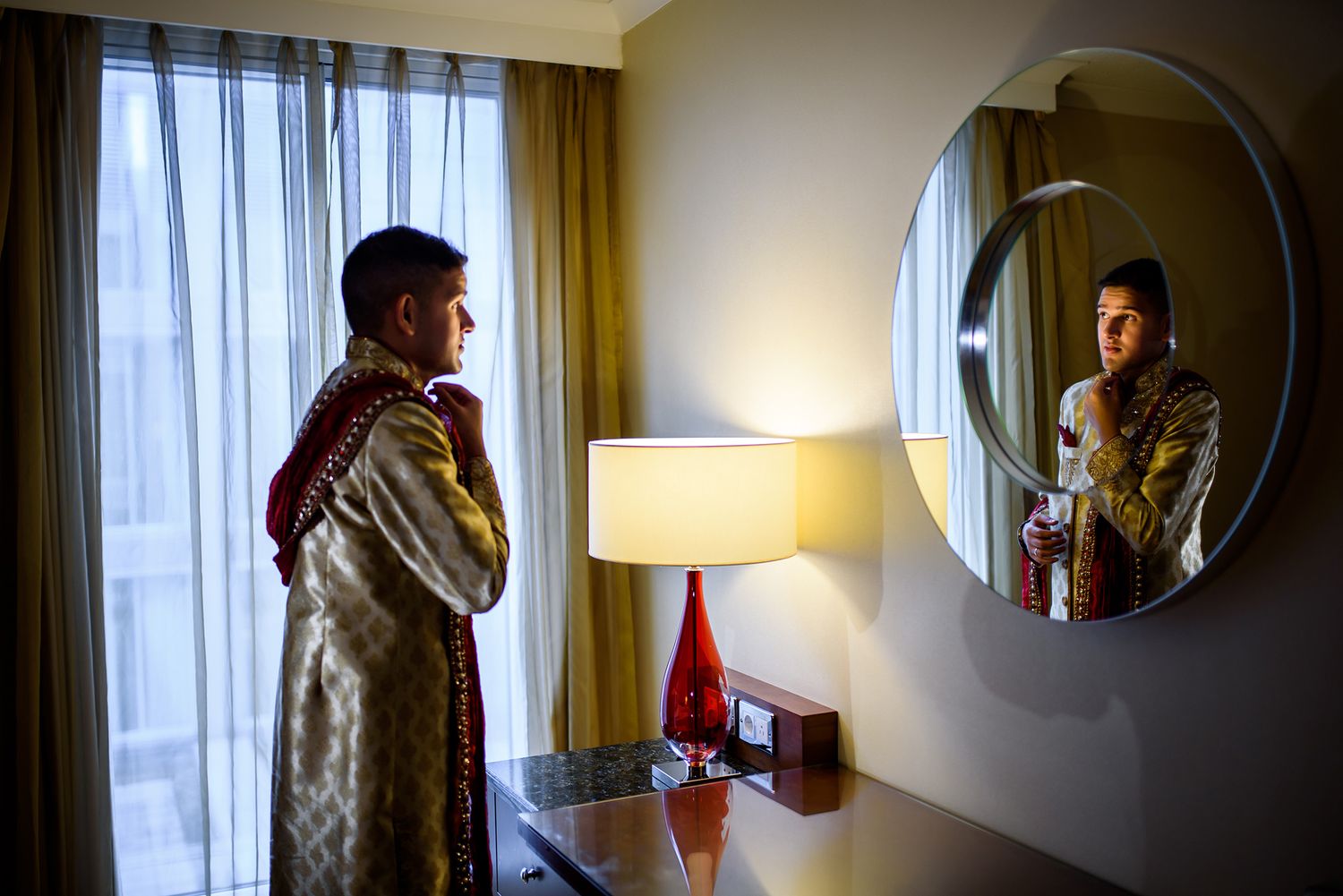 Series of silhouetted shots showing morning wedding preparation in hotel room.