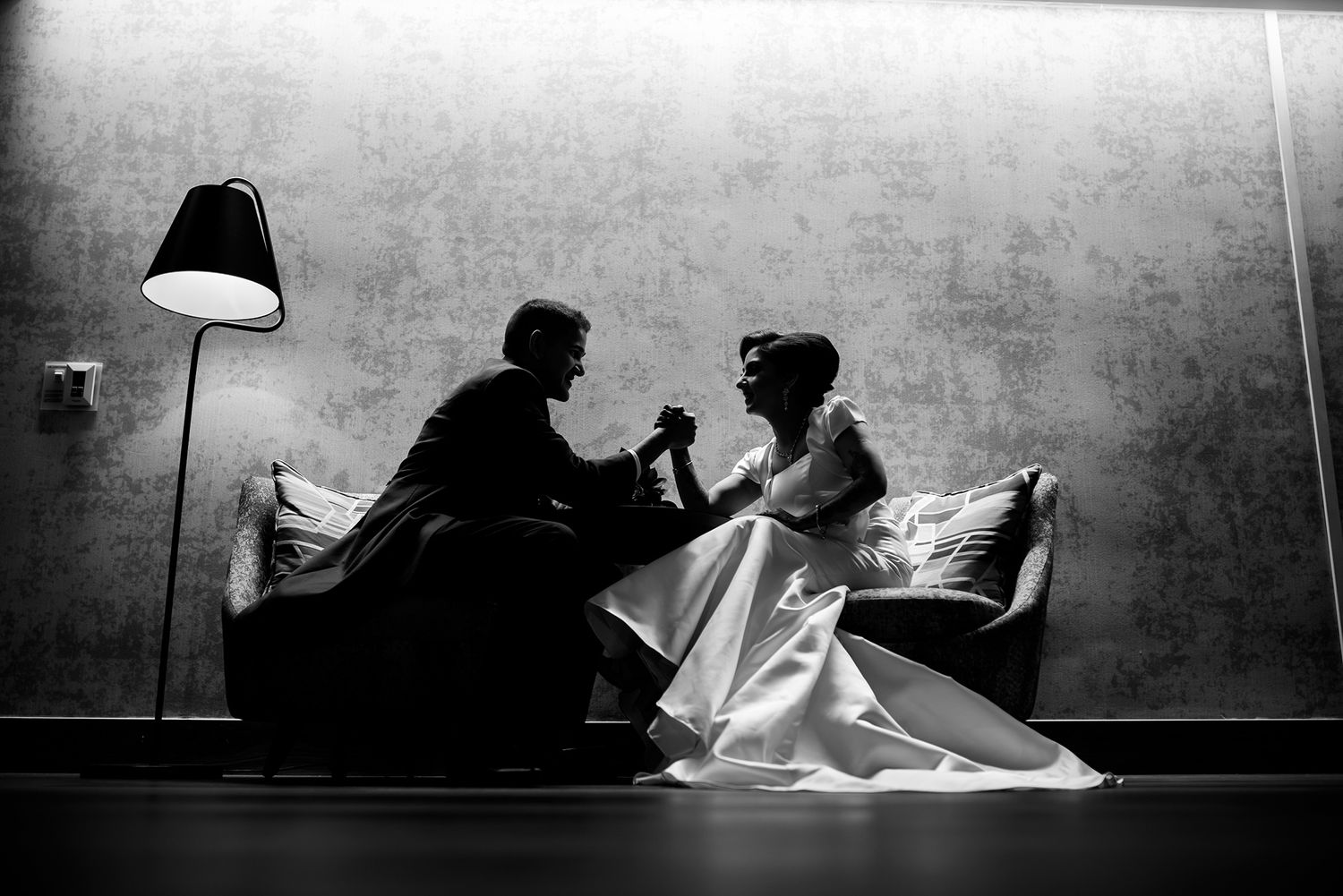 Dramatic black and white silhouettes of wedding photography session.