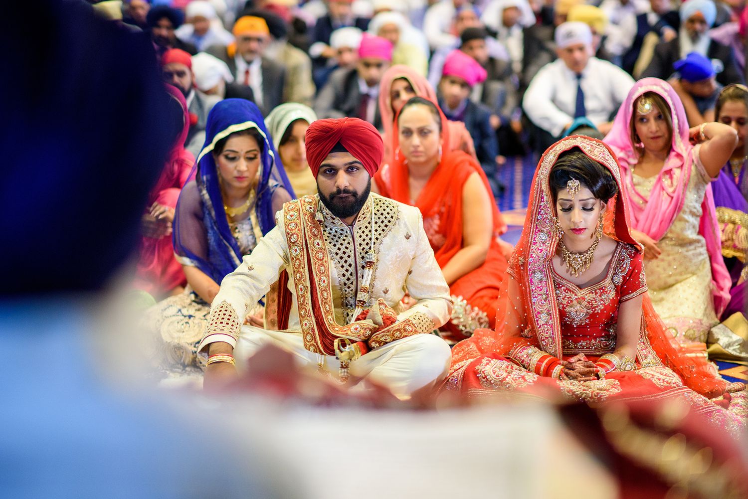 Guests seated during a traditional Sikh wedding ceremony.