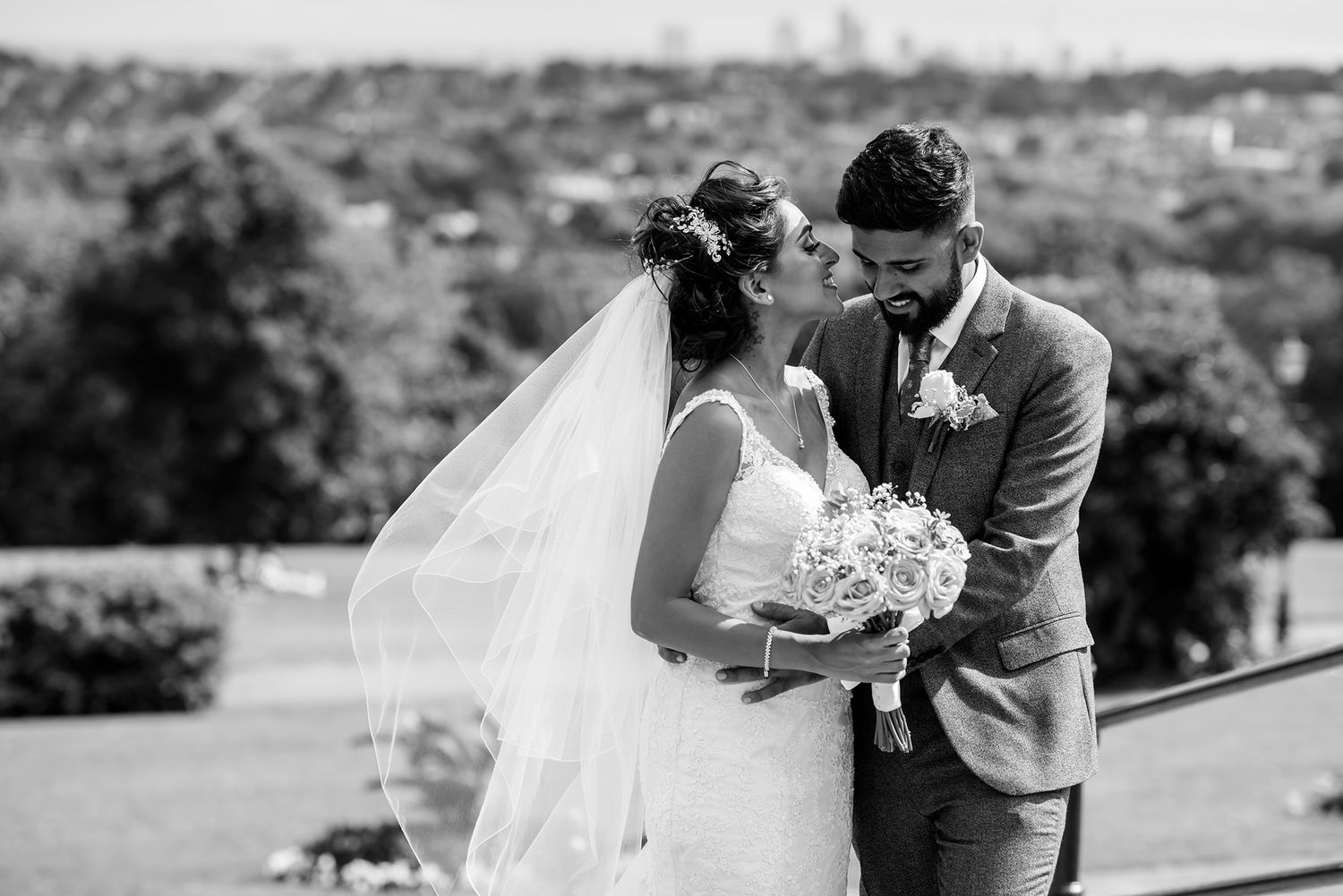 Romantic outdoor wedding portraits captured in a scenic natural setting.
