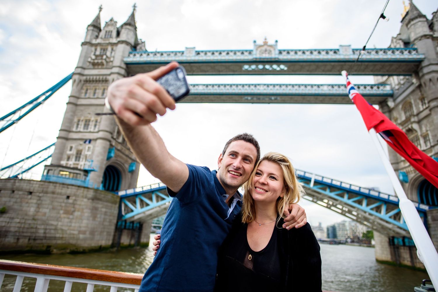Artistic series of photos featuring London's Tower Bridge against cloudy sky.