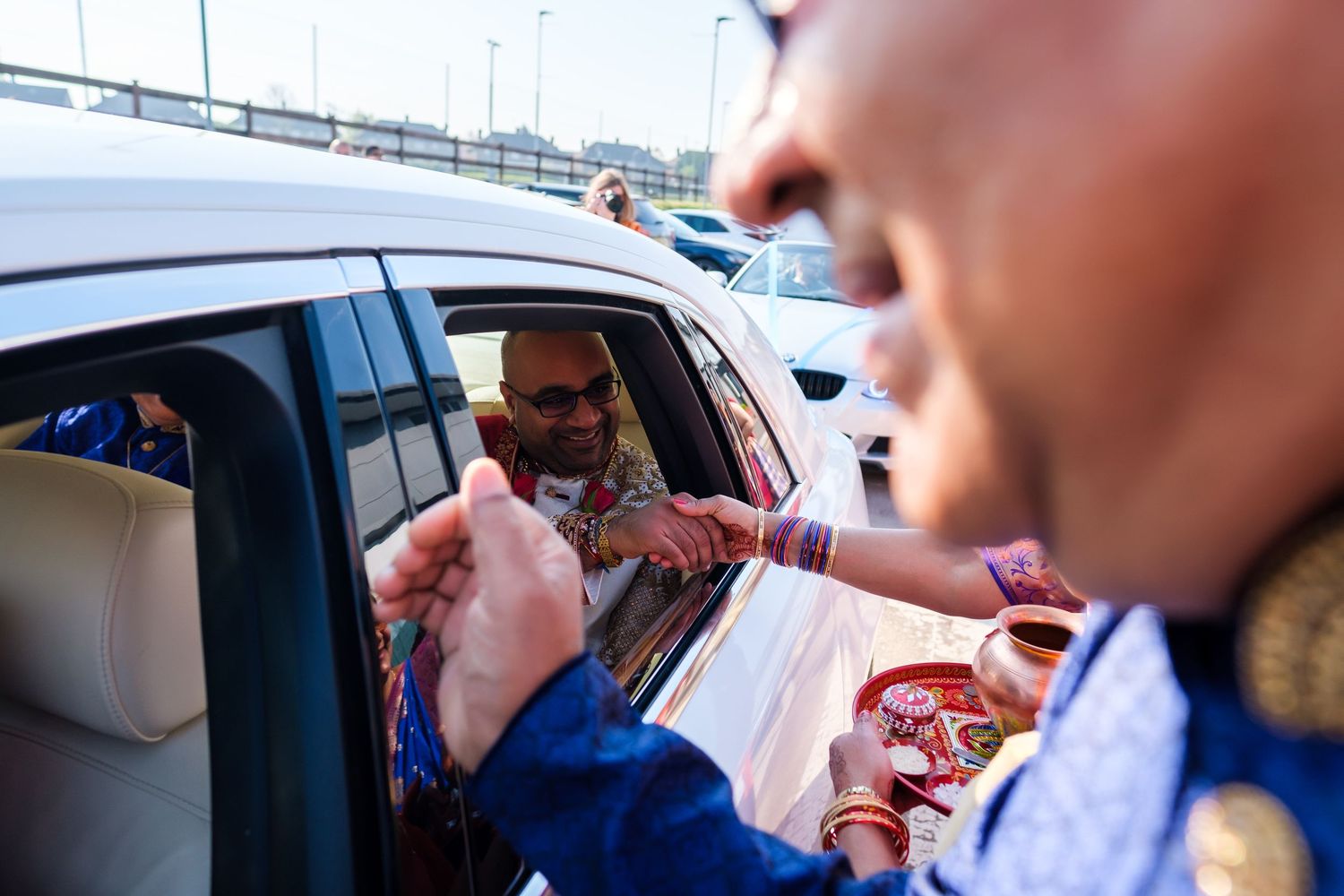 A series of images showing hands exchanging money and items through car windows at a drive-through window.