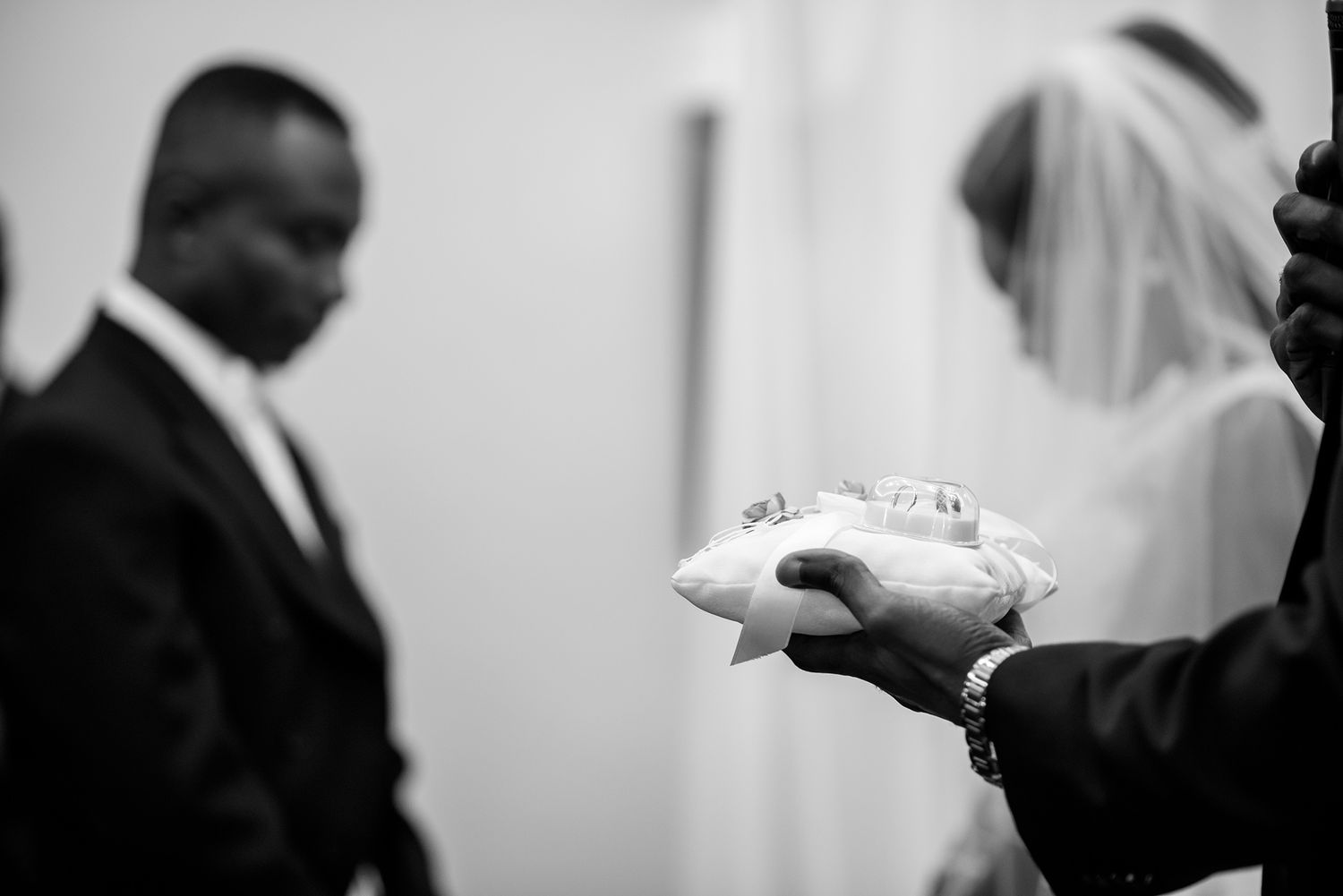 Emotional monochrome moment captured during a wedding ceremony.