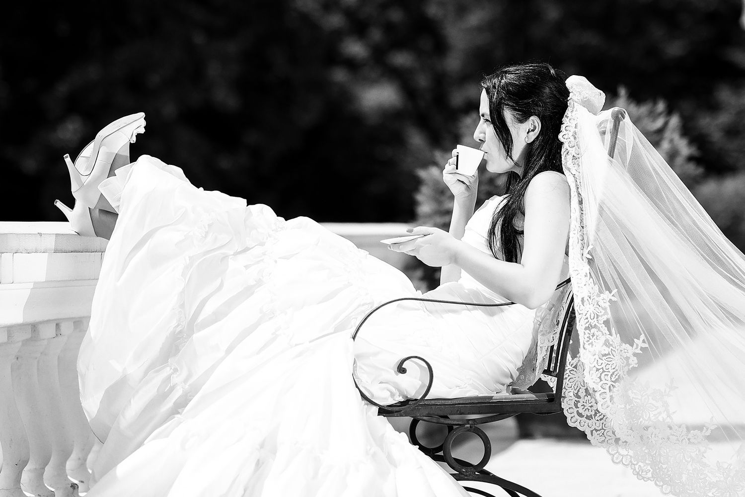 Close-up shots of elegant white wedding dress details and romantic couple moments in black and white.