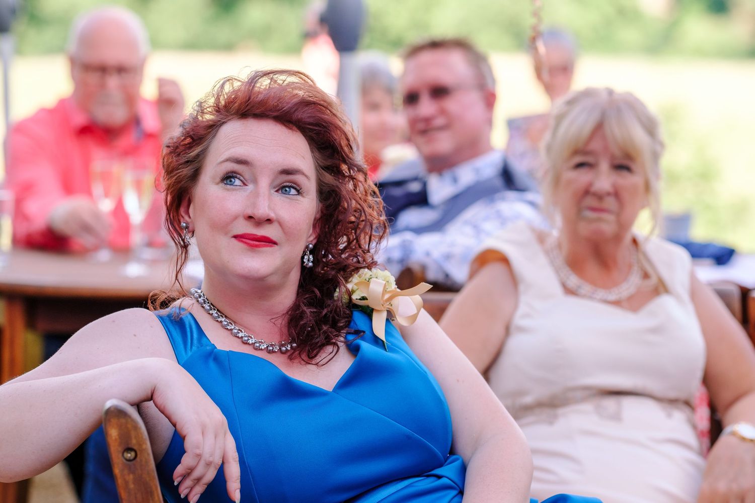 Guests enjoying themselves at an outdoor wedding celebration.
