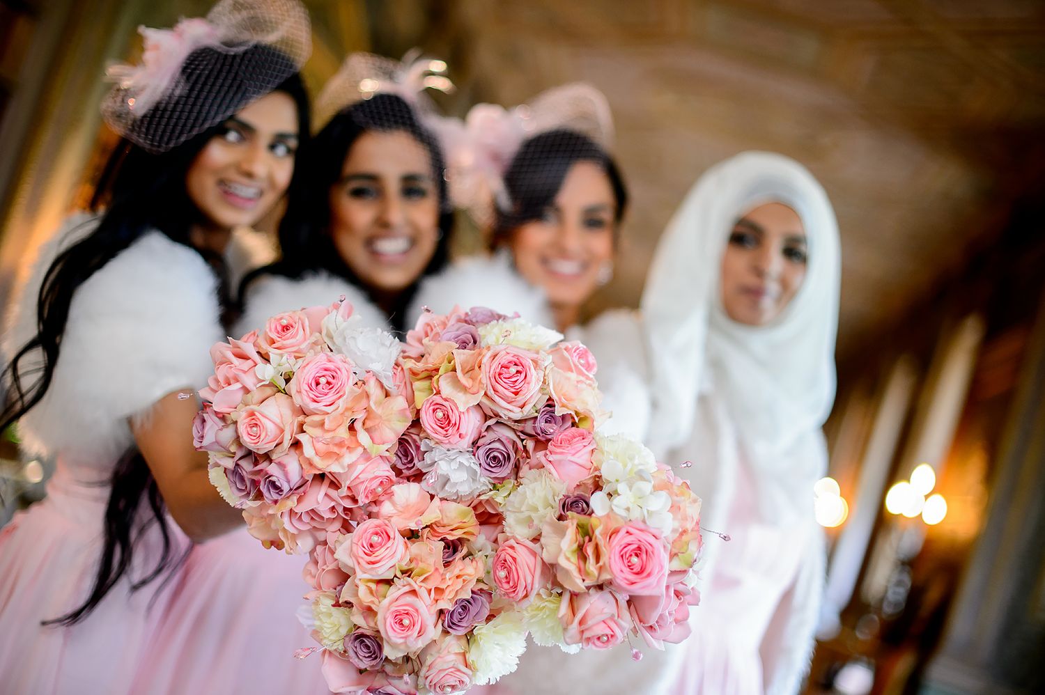 Pink and white rose bouquets arranged for a formal wedding celebration.