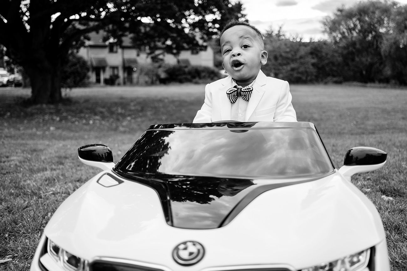 Vintage style black and white photos of a luxury car outdoors.