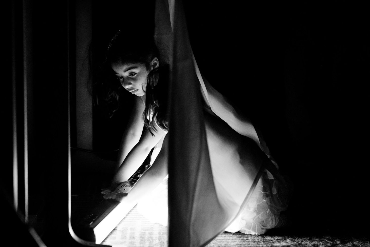 Dramatic silhouette photography capturing intimate wedding moments in black and white.
