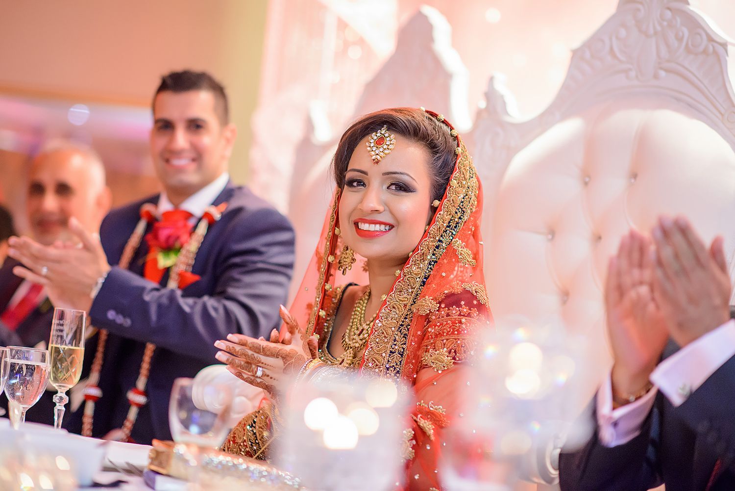 Wedding reception celebration with elegant decor and warm lighting creating a festive atmosphere.
