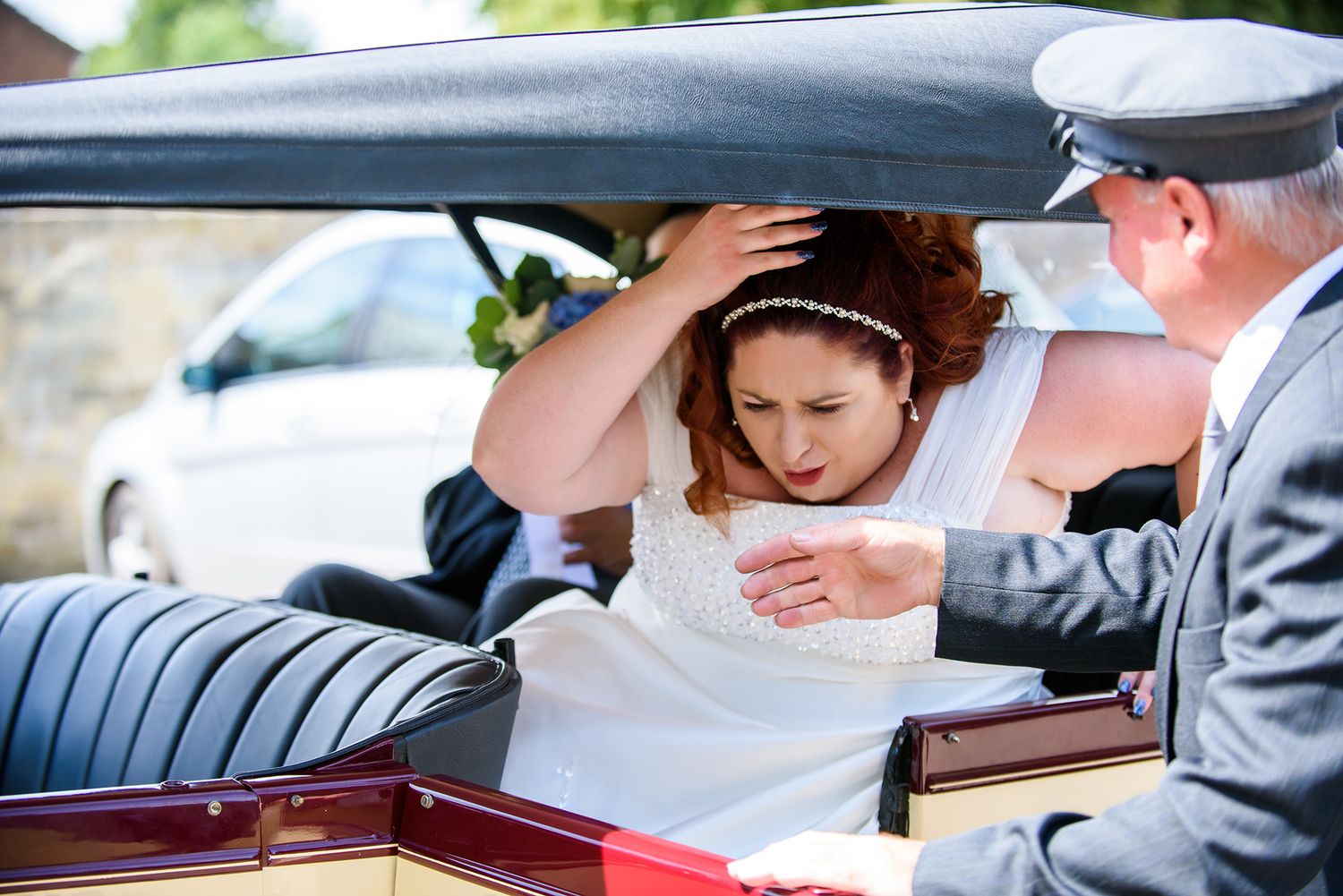 Wedding guests signing the official marriage register at an outdoor ceremony.