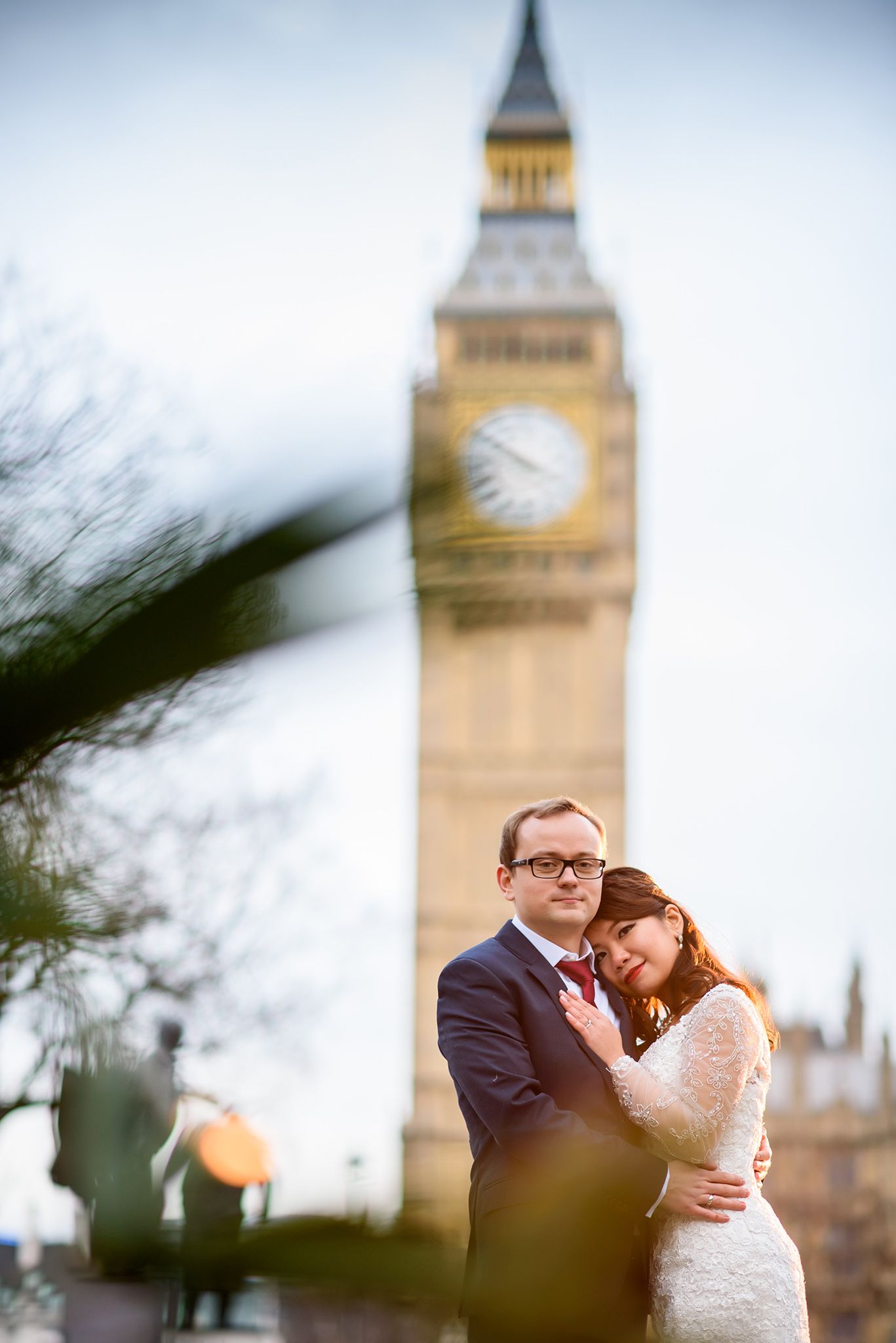 Intimate wedding moment captured with Big Ben tower rising majestically in the background.