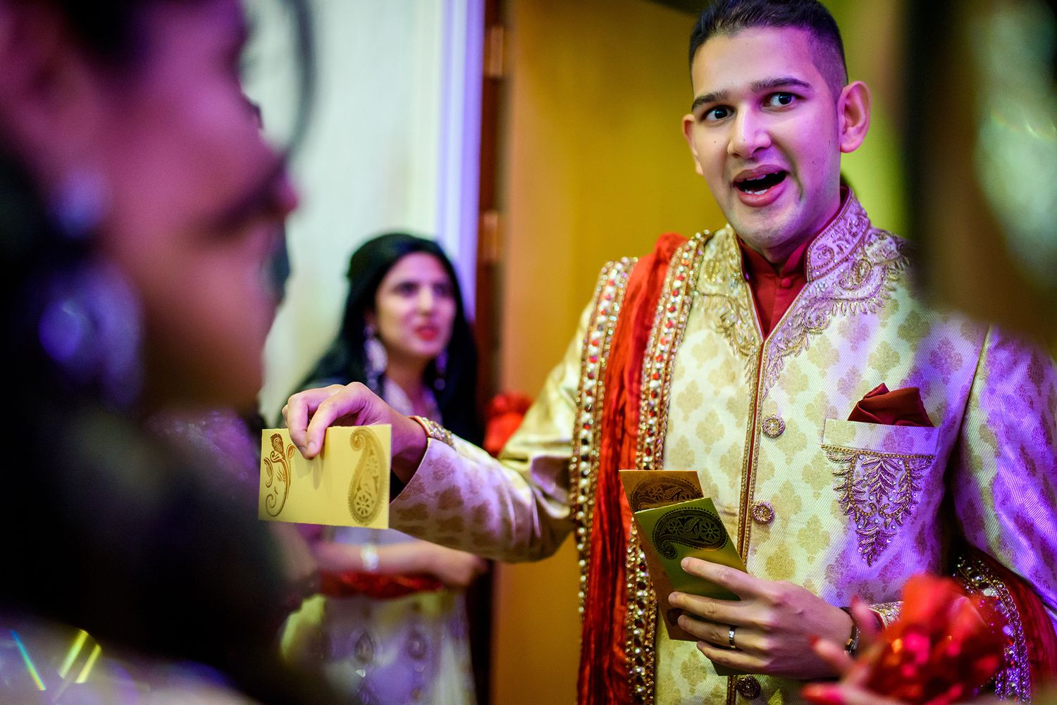 Wedding celebration with colorful traditional attire and festive lighting.