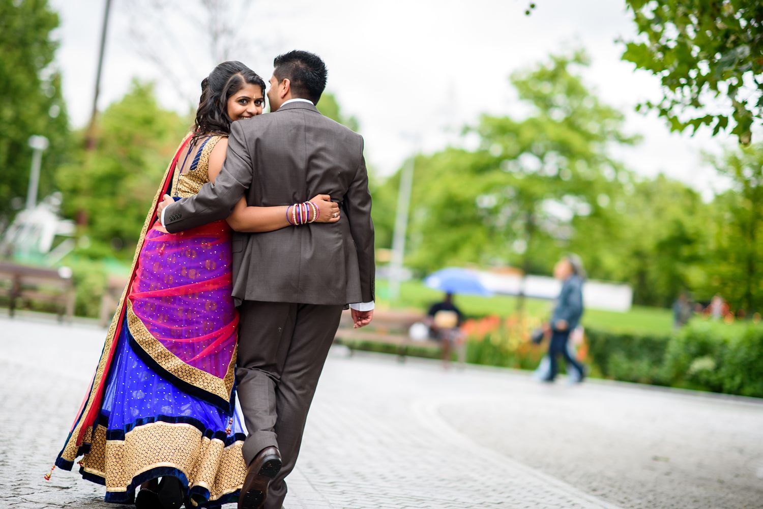 Romantic dance sequence in front of classic architecture with colorful traditional attire.
