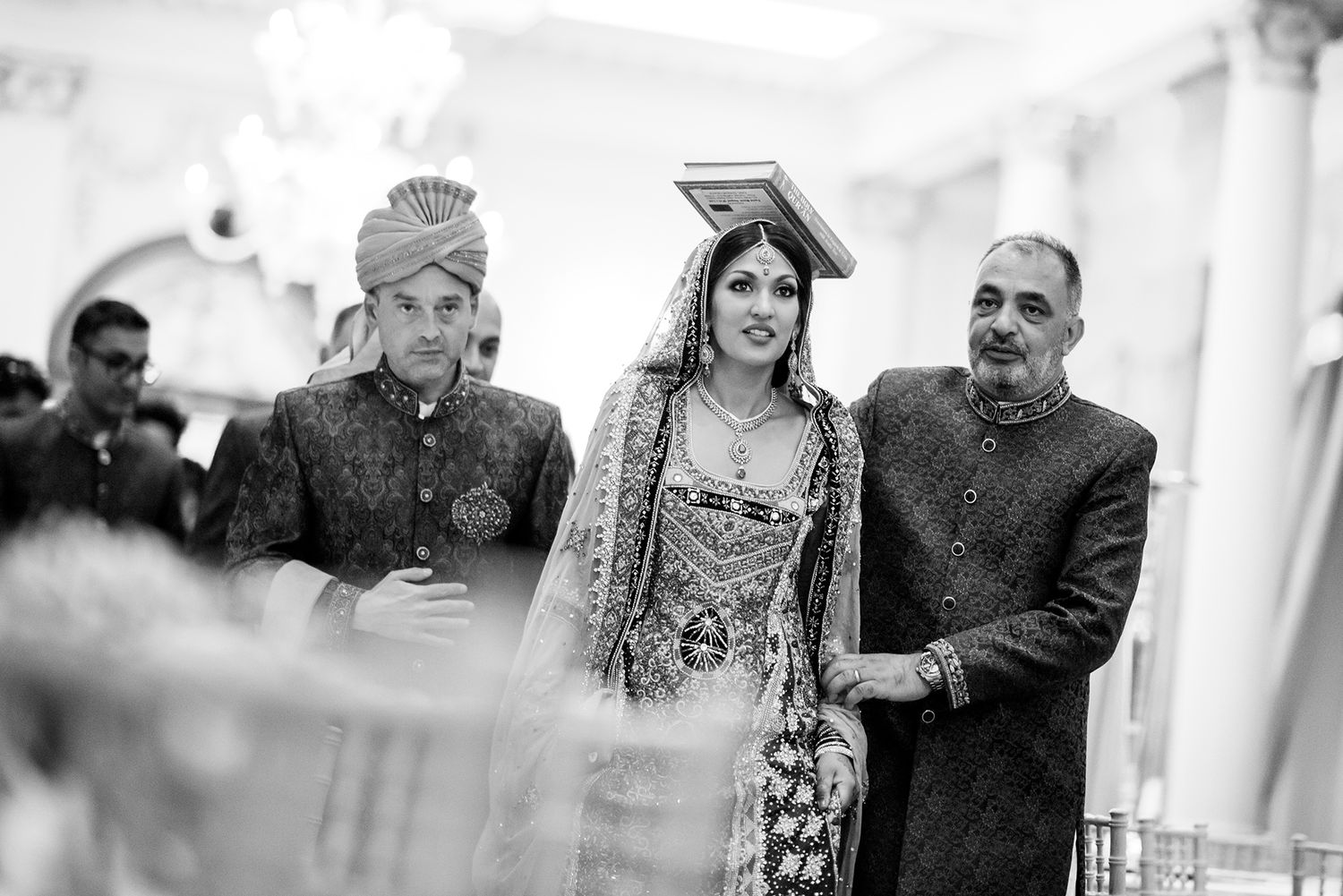 Candid moments captured during a traditional South Asian wedding ceremony.