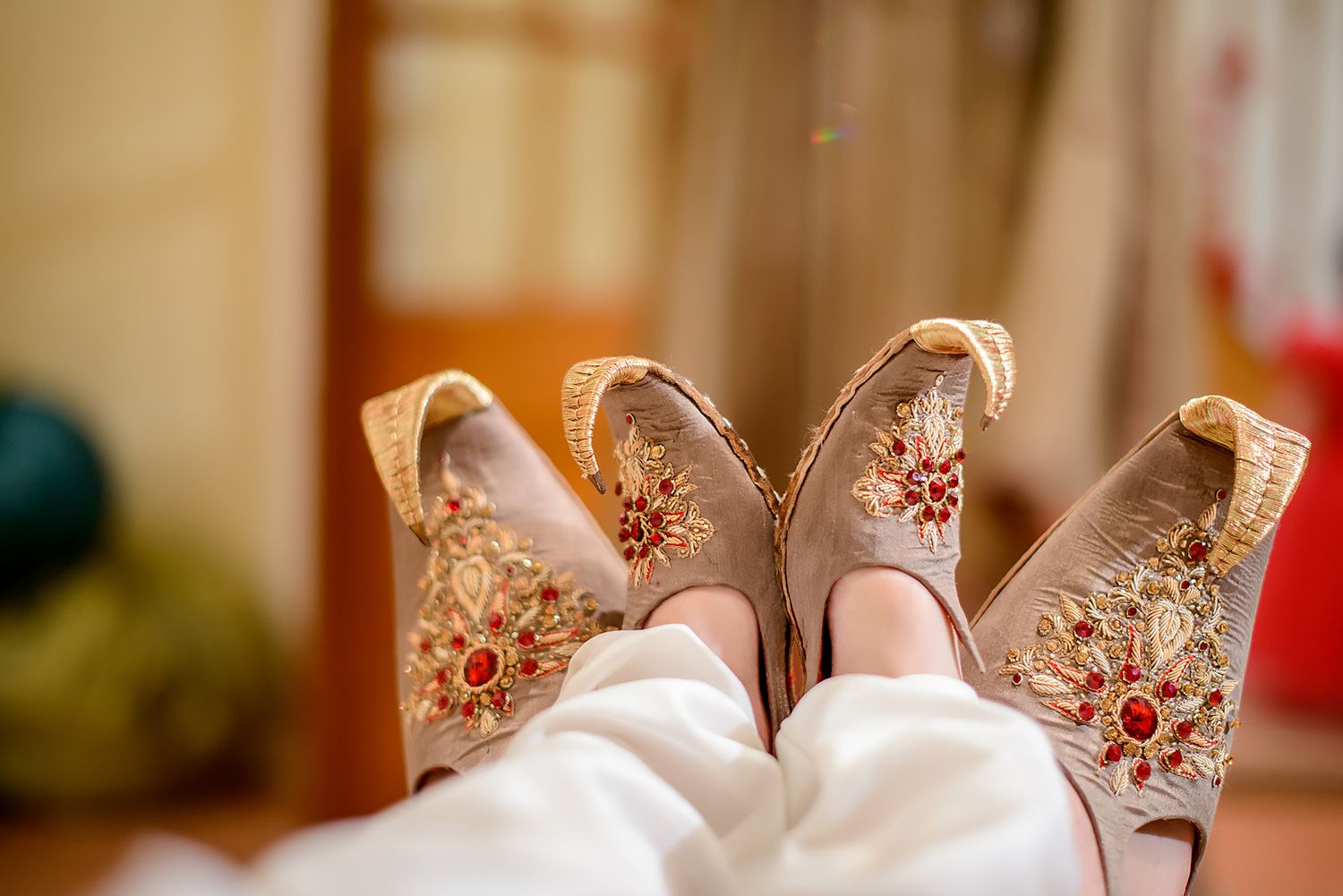 White and red embroidered wedding details with delicate floral patterns.
